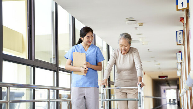Lady taking a walk with her nurse