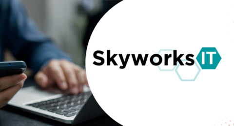 Skyworks IT logo and photo of a man using a laptop and cellphone